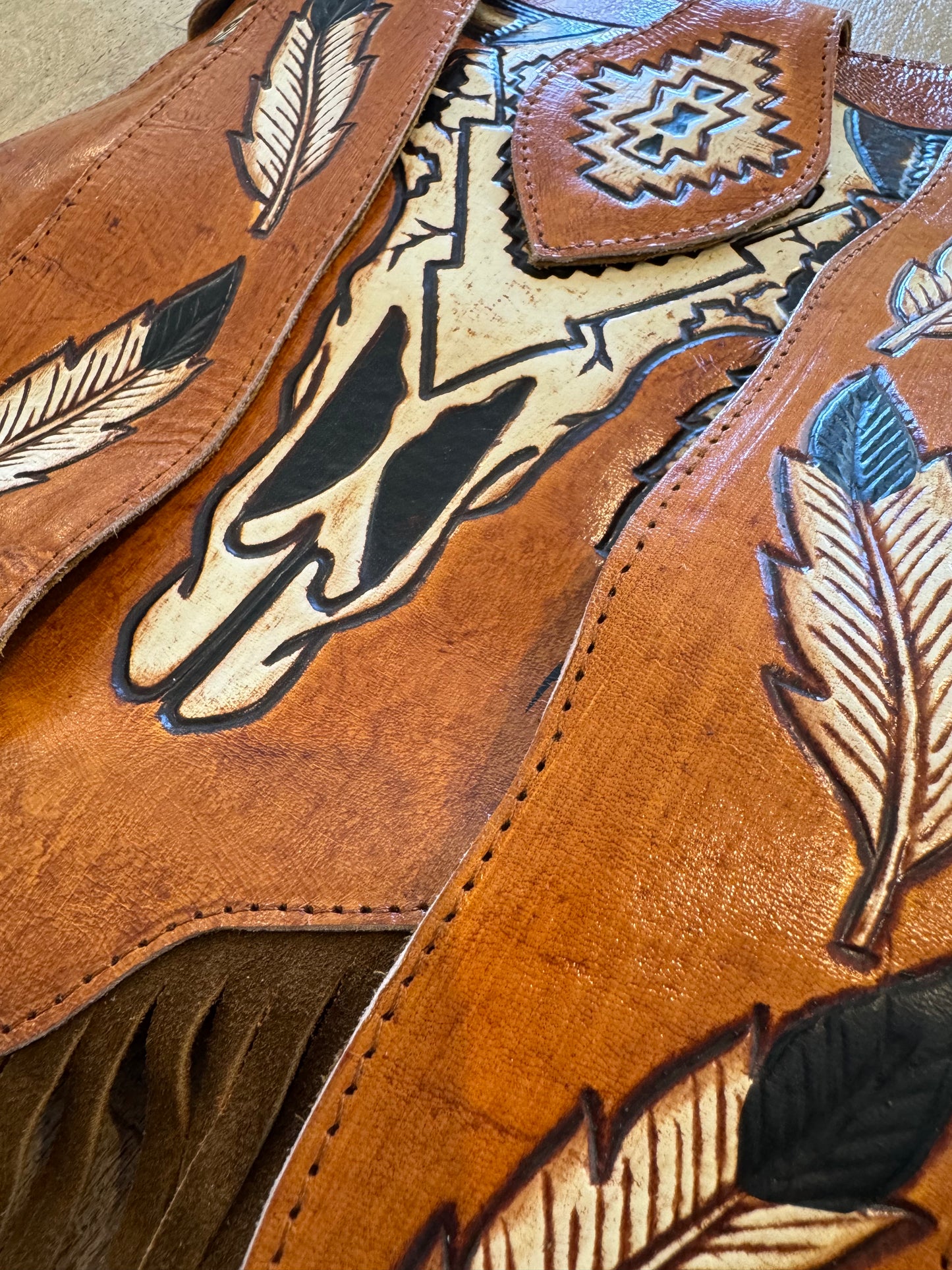 Close-up of intricate carving and tassels on the Boho Bronco Bag – slow fashion meets country chic