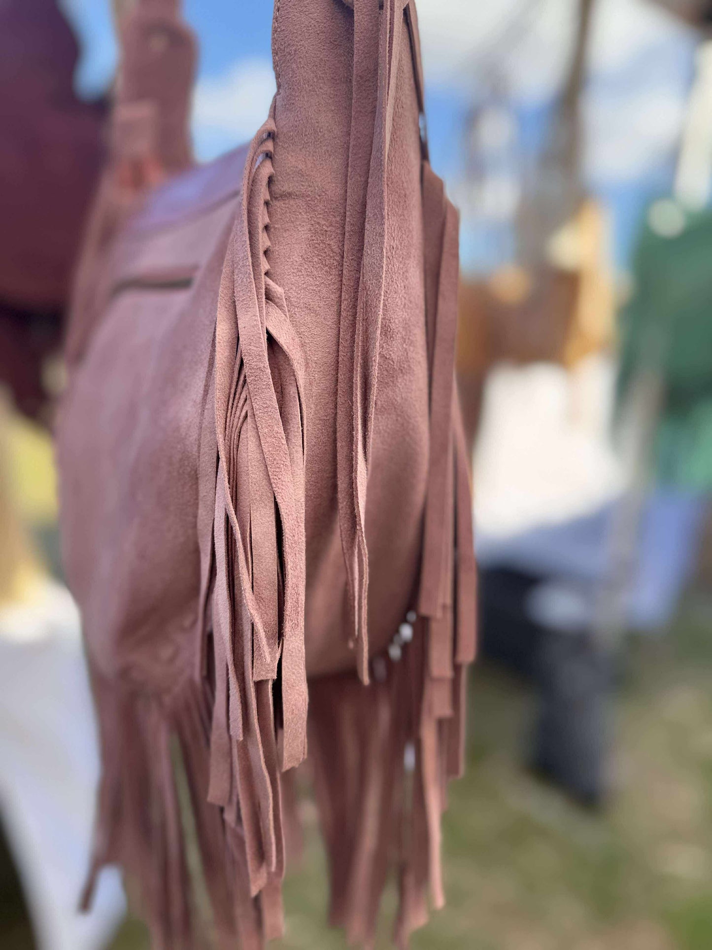 Boho leather bag for women – blush pink cross body with Western-style tooling and long fringe