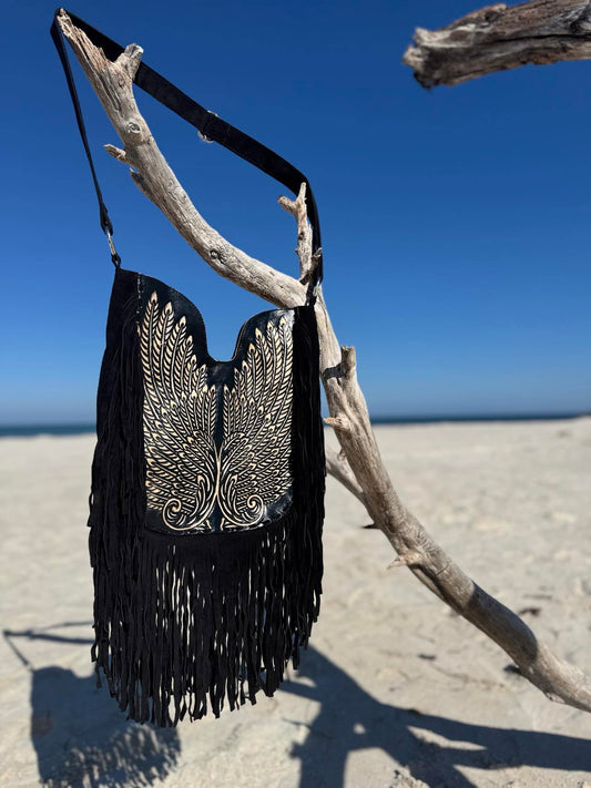 Boho leather crossbody bag featuring a handcrafted wing design in silver embroidery on metallic navy napa leather.