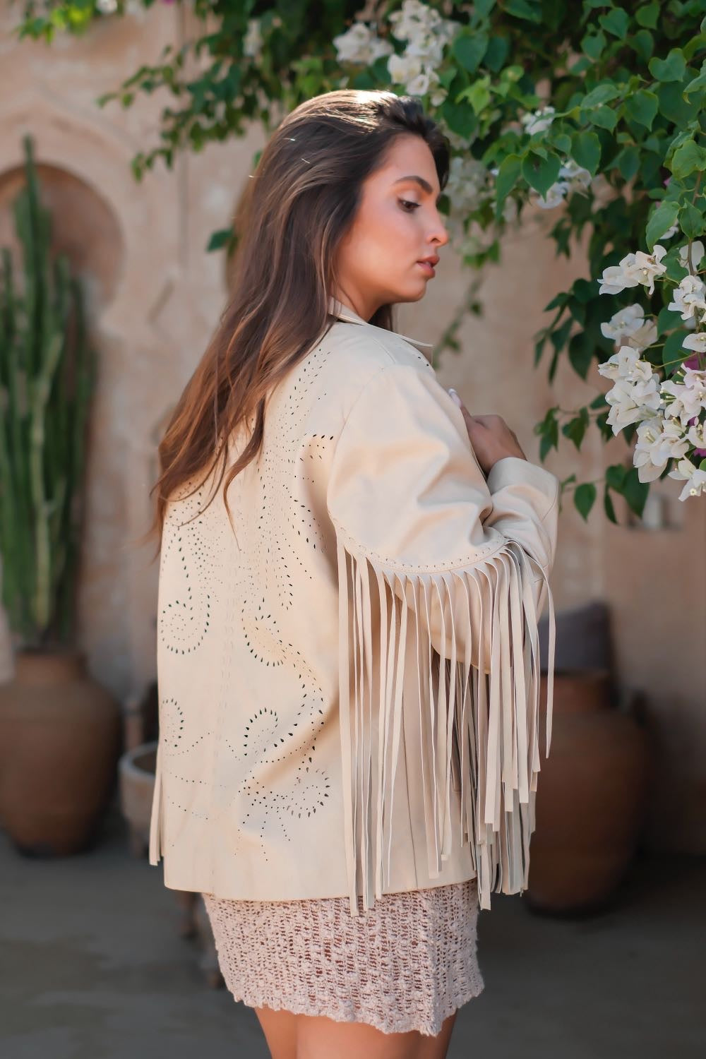 Boho western leather jacket for women in natural cream with long fringe sleeves