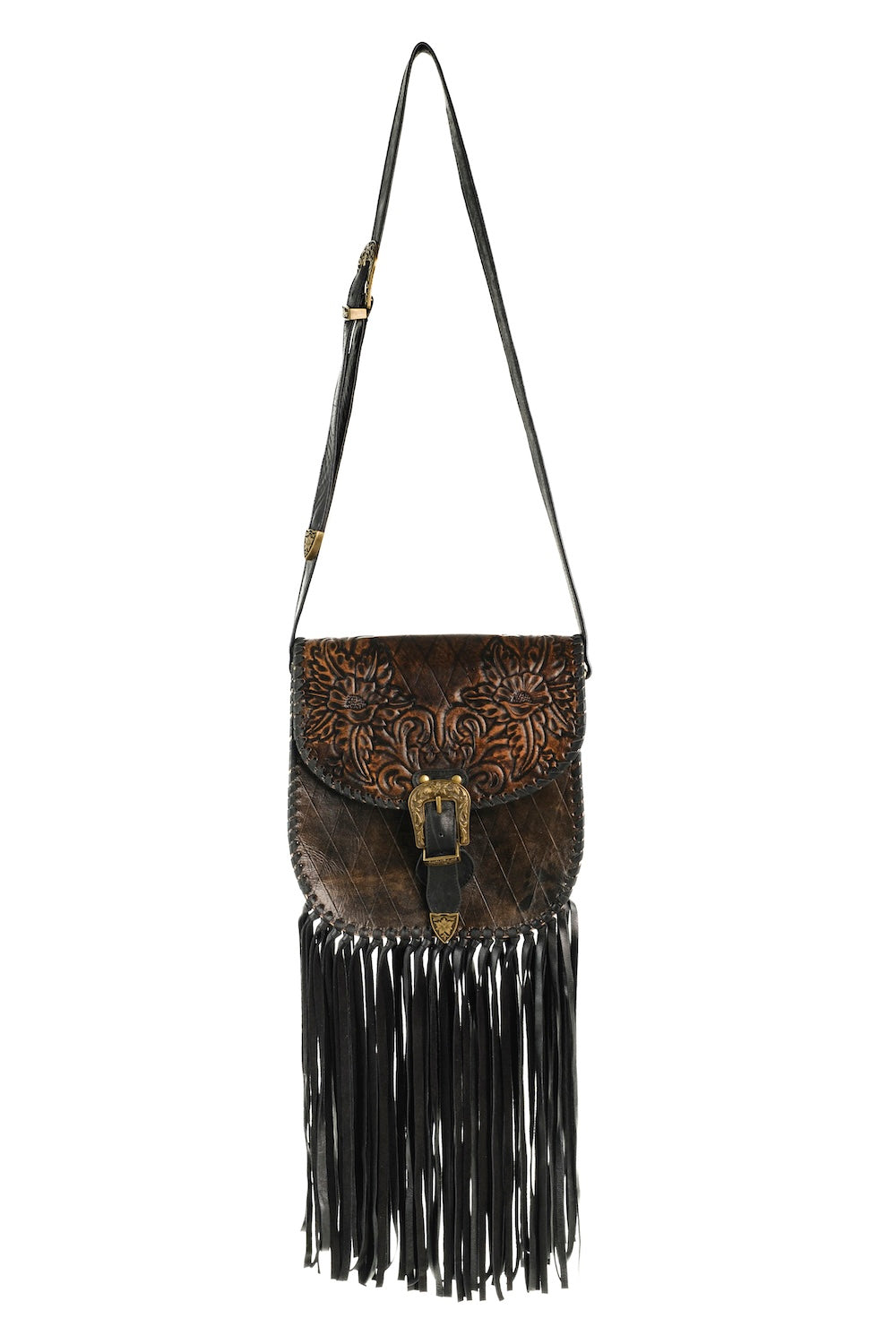 Brown leather bag with black fringe and decorative patterns on a white background