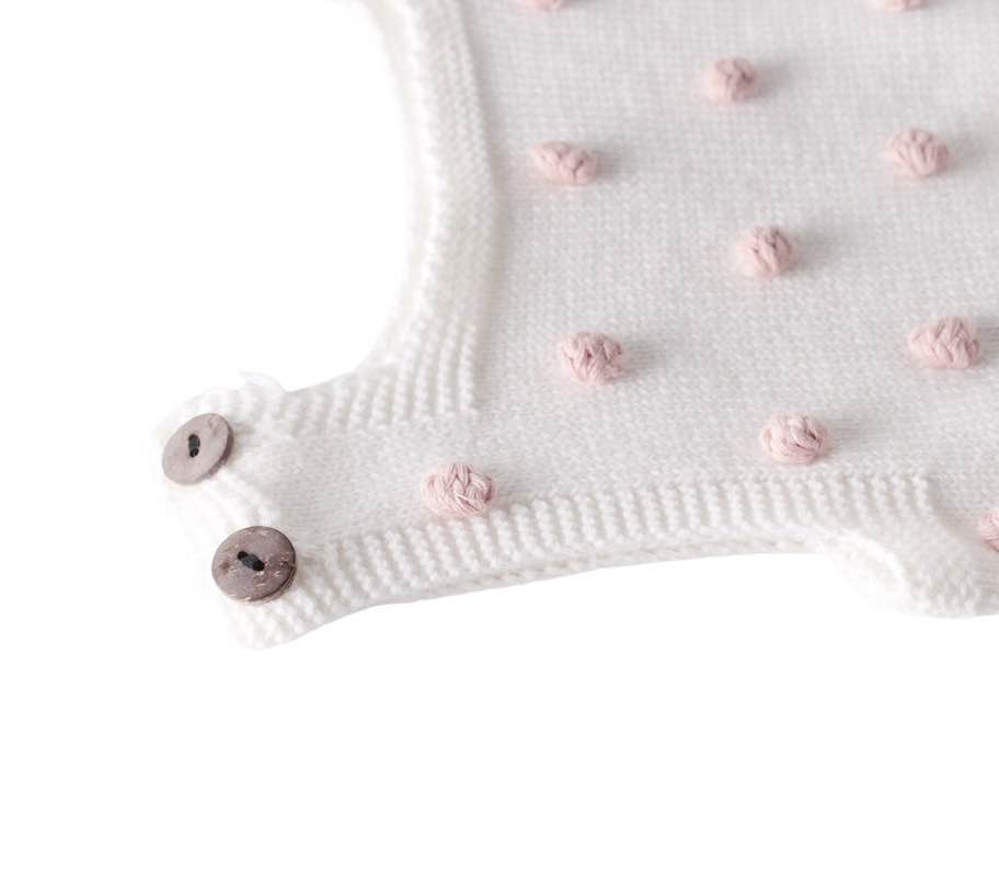 Casual newborn baby romper with lace-up design and pompom accents