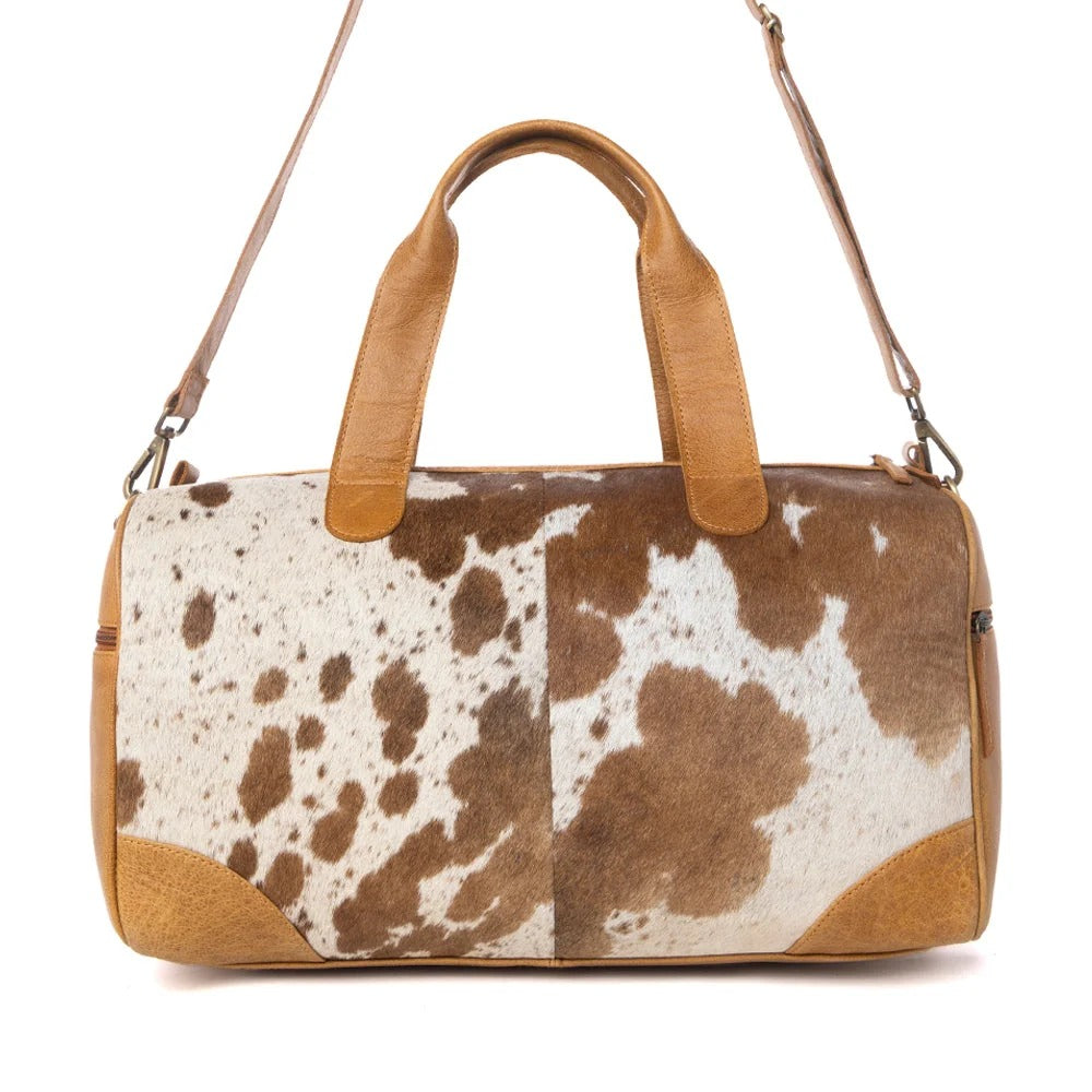 House of Hide genuine leather brown and white cow print handbag with premium leather accents on a white background