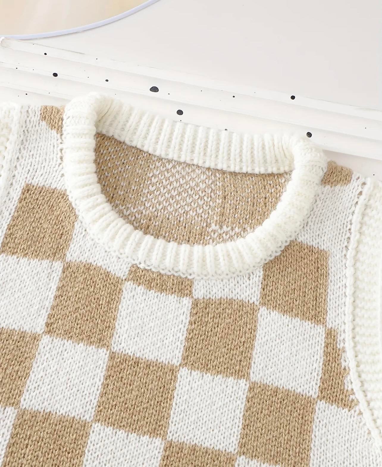 Toddler wearing a cream and coffee checkered knit vest and shorts set, perfect for summer comfort.