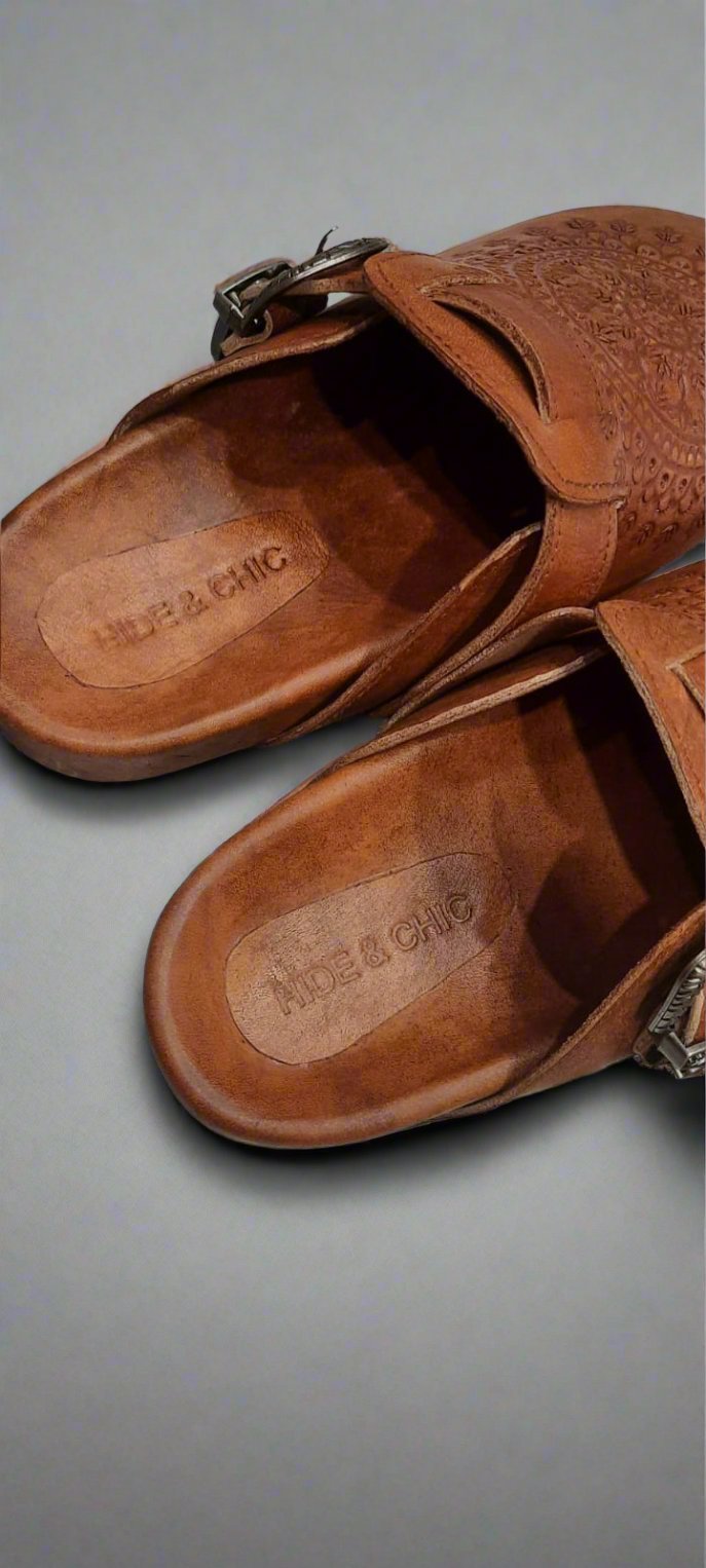 Close-up of buckle on Western Boho Clogs – A detailed image of the vintage-style buckle on the side of the brown leather clog.