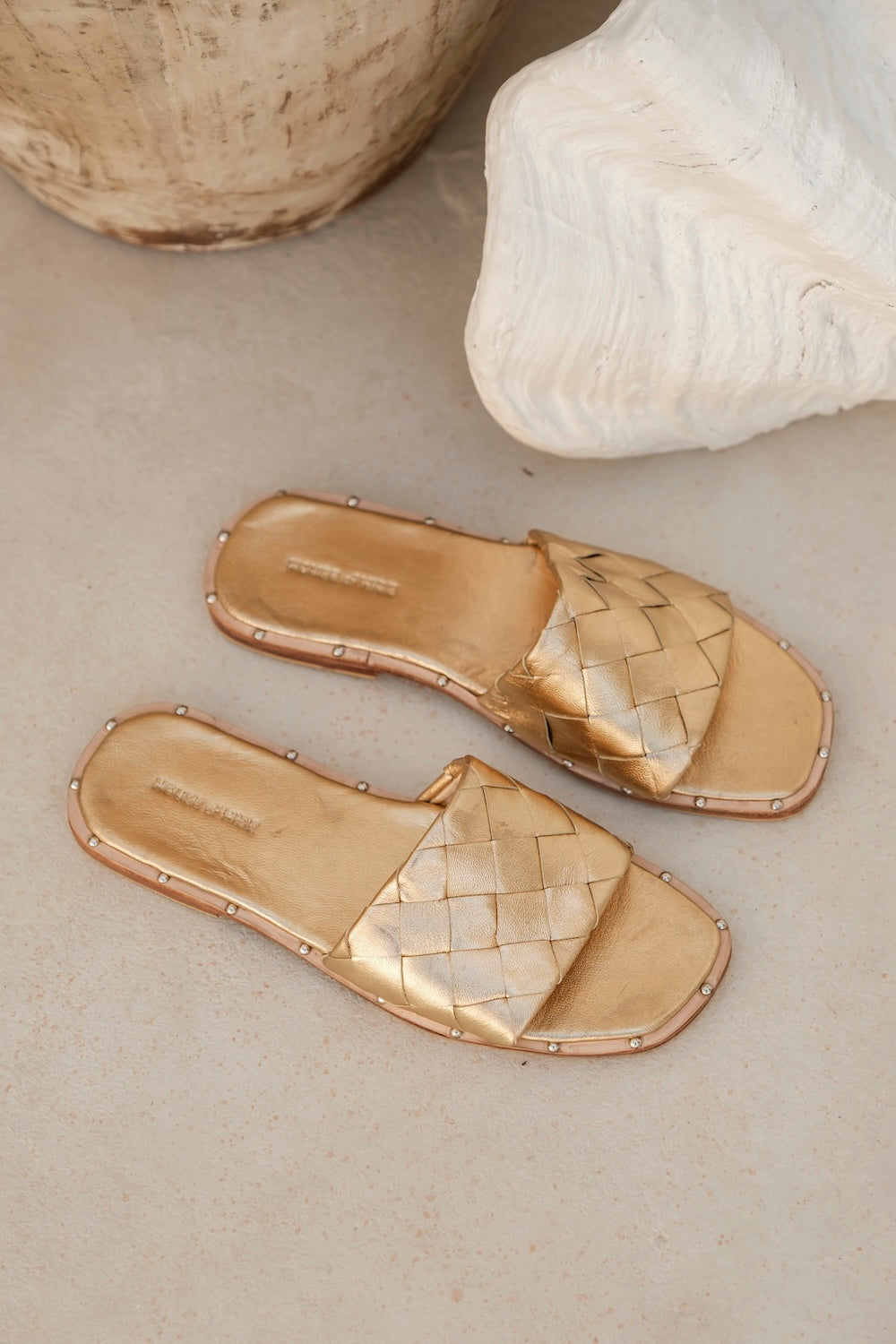 Bunker Bay Woven Slide in gold leather, a Bottega-inspired woven flat mule designed for Australian summer wear