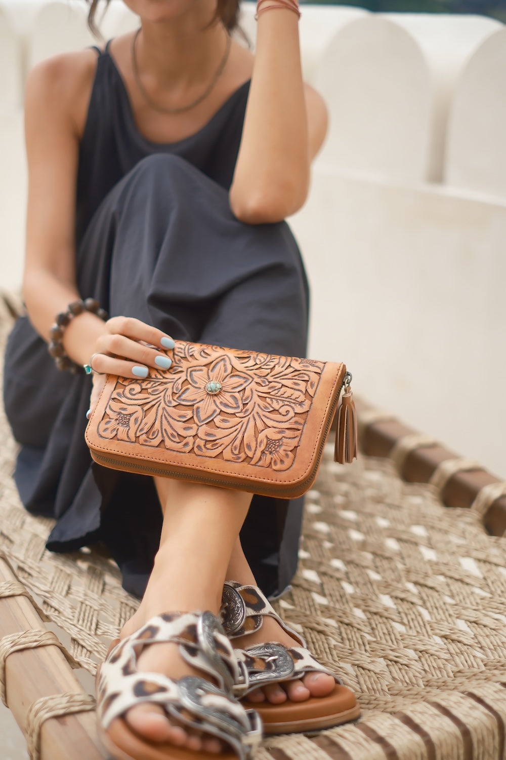 Styled shot of leopard print western slides worn with vintage denim, blending comfort and bold animal print flair for everyday wear.