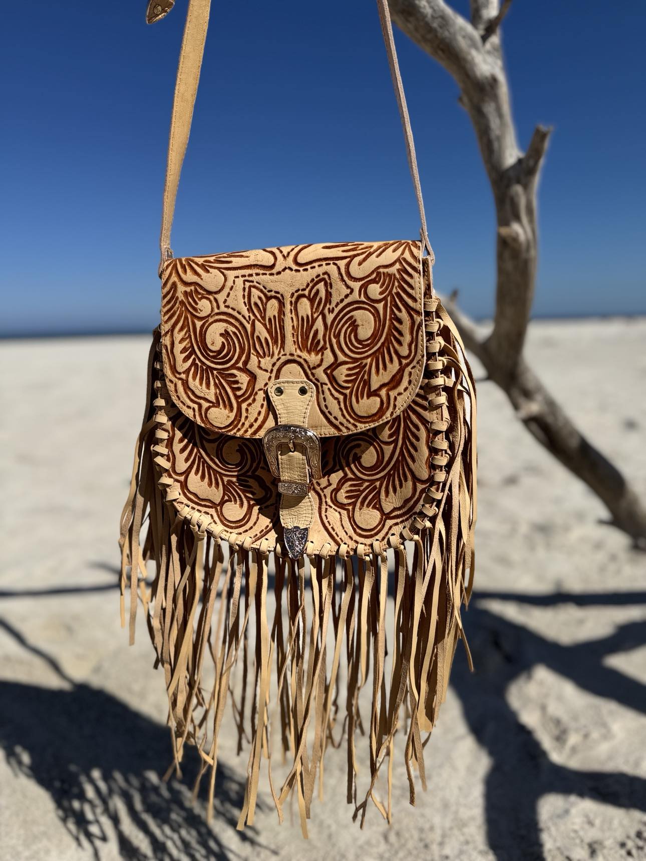 Compact real leather Savannah Western Fringe Bag worn crossbody with adjustable strap.