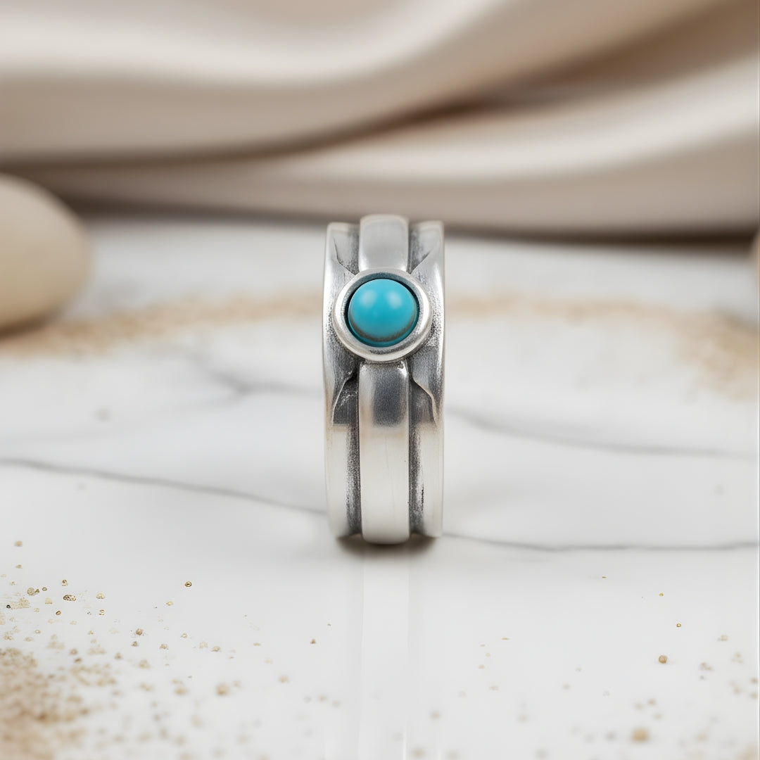 Coral Shoreline Ring displayed on white surface handcrafted silver and turquoise design