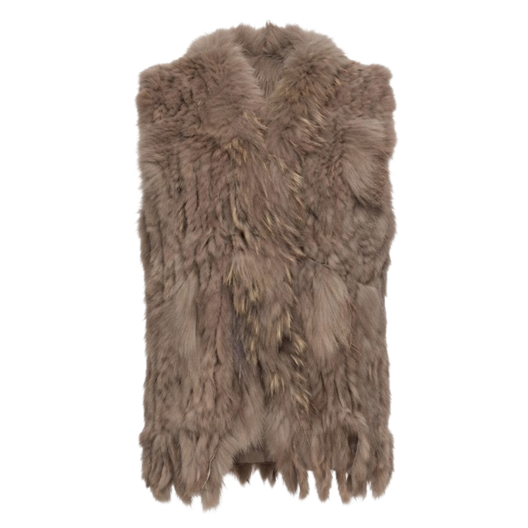 Cottontail Fur Vest from House of Hide in soft earthy khaki real rabbit fur with plush raccoon fur collar, fringed hem detail, single button closure, sleeveless silhouette being displayed on neutral background as versatile layering piece for winter styling