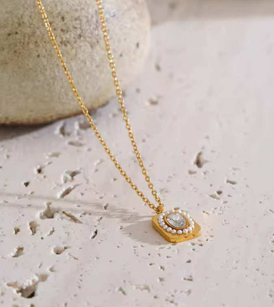 Dainty pearl and gold pendant necklace with country-boho flair
