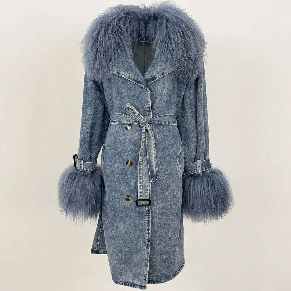 Denim Trench Coat from House of Hide in acid-wash denim with plush faux fur collar and cuffs, adjustable tie belt for tailored silhouette, button-front closure with classic lapel detailing, long relaxed silhouette being displayed on neutral background