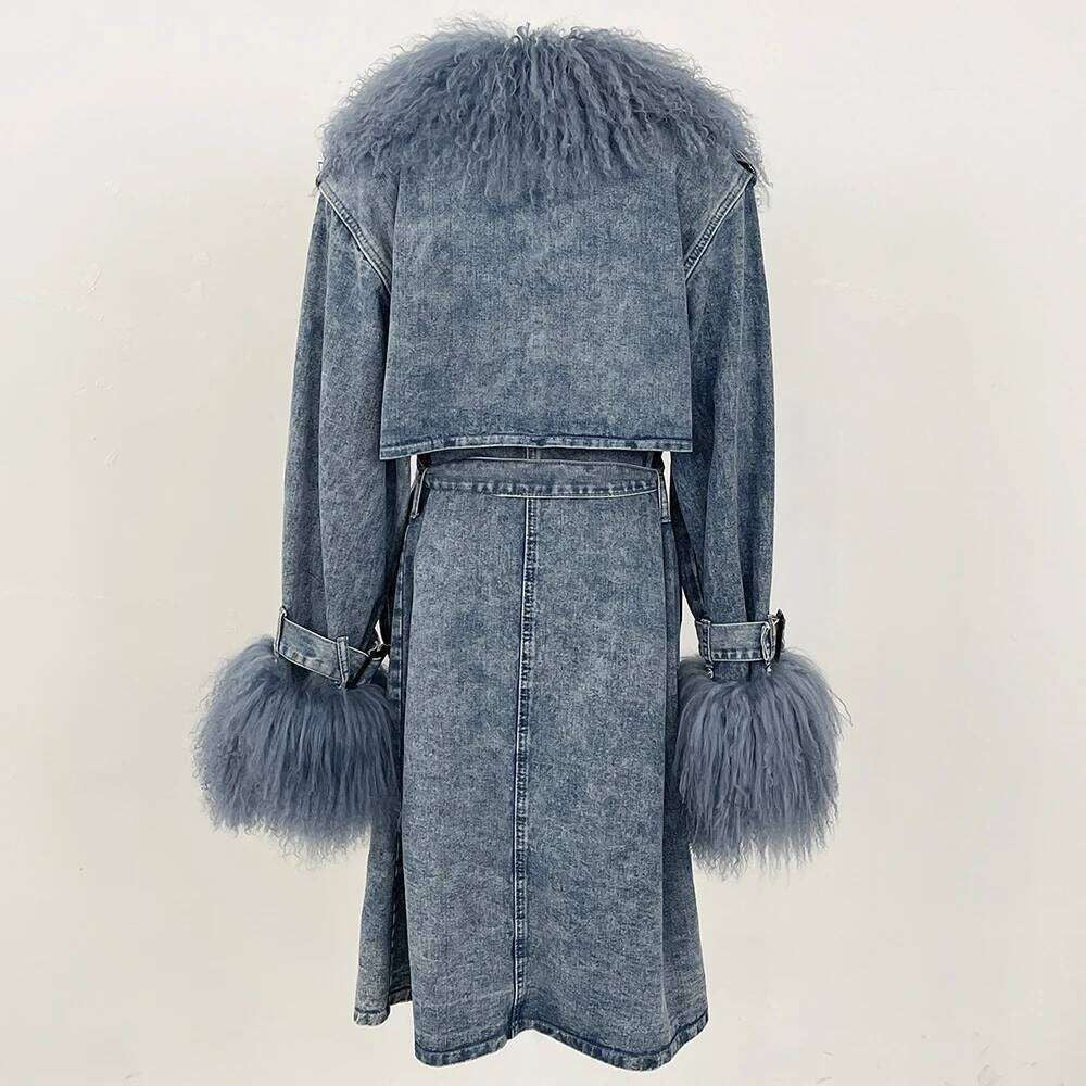 Denim Trench Coat from House of Hide in durable acid-wash denim construction with plush faux fur trim at collar and cuffs, cinching tie belt, button closures, long tailored silhouette designed for layering over dresses, trousers or jeans