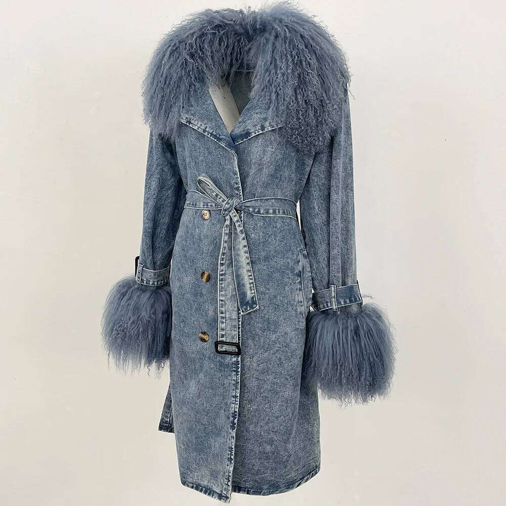 Denim Trench Coat from House of Hide in refined acid-wash denim with plush faux fur collar and cuff detail, cinching tie belt, button-front closure with lapels, long relaxed silhouette designed as versatile layering piece for multiple styling occasions