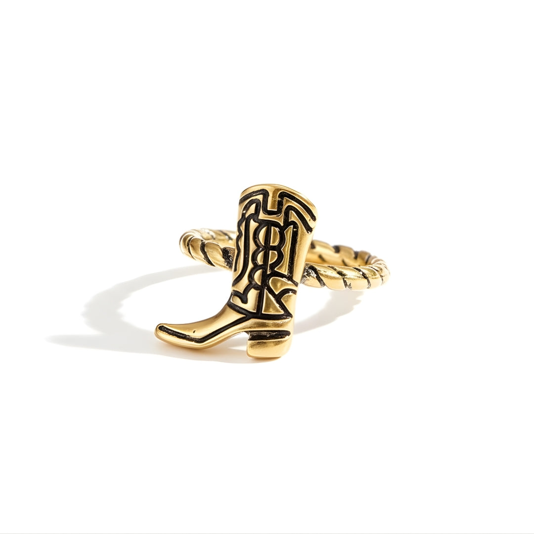 Gold cowboy boot ring by House of Hide Perth displayed on white surface