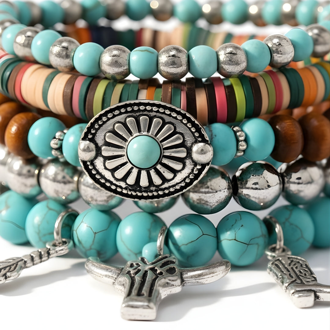 Stack of multicolored beaded bracelets with metal charms by House of Hide Perth jewellery