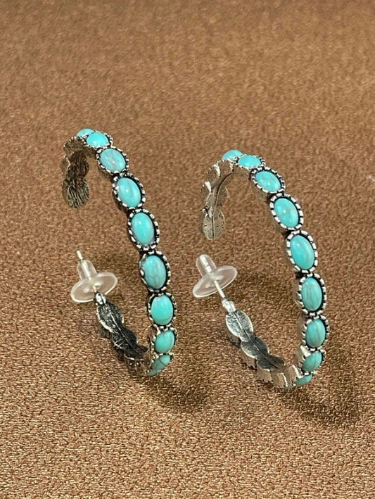 Rustic earrings Australia, half-hoop design with turquoise stones in silver bezels and feather detailing for Western country charm.