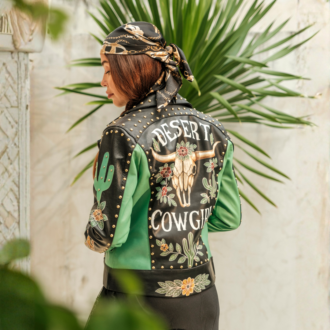 The Desert Cowgirl Jacket by House of Hide with hand-painted longhorn skull, floral artwork, cacti, turquoise leather and brass studs.
