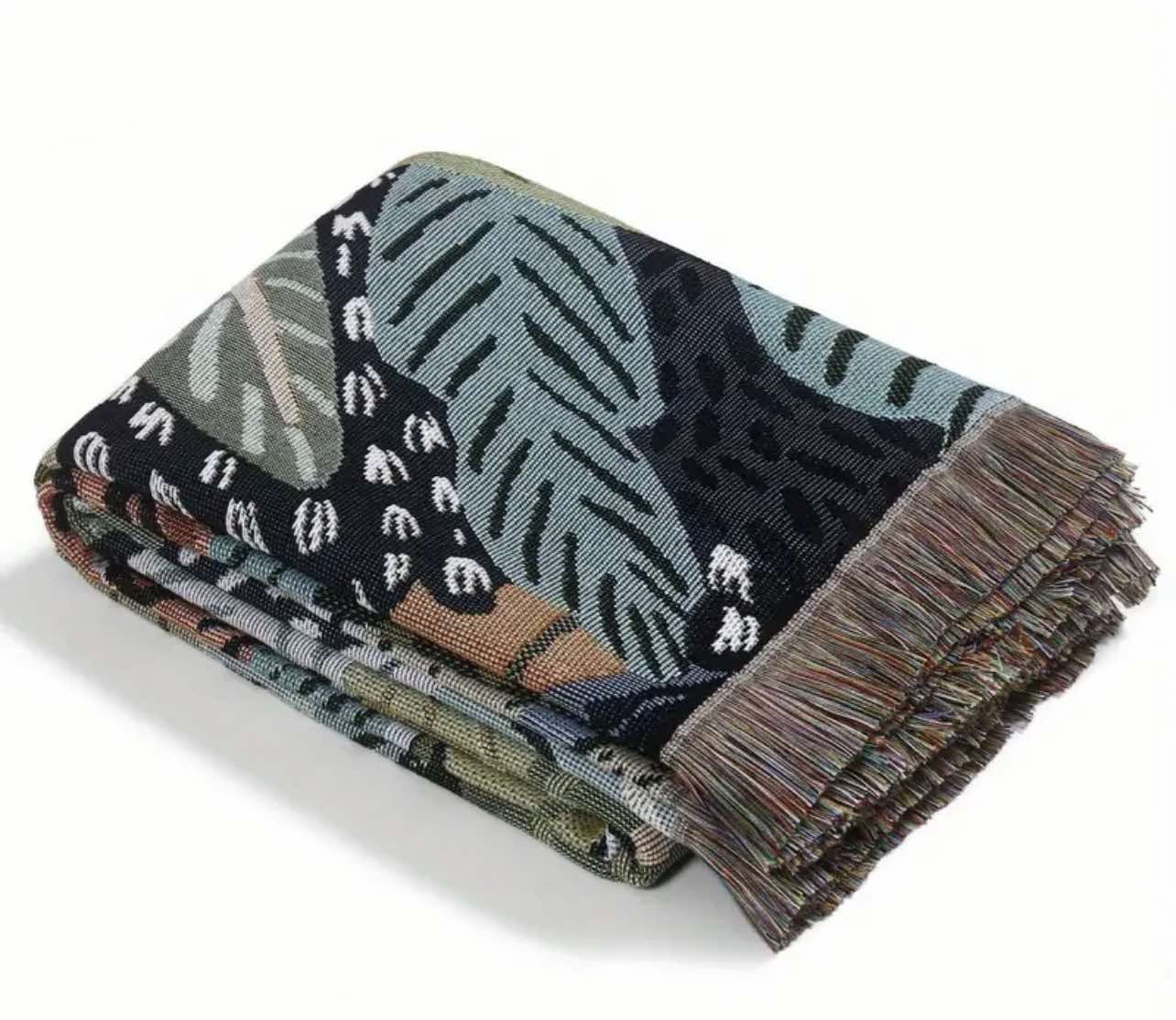 Detail shot of the Serenity Forest Throw Blanket with intricate, nature-inspired patterns and rich colors.