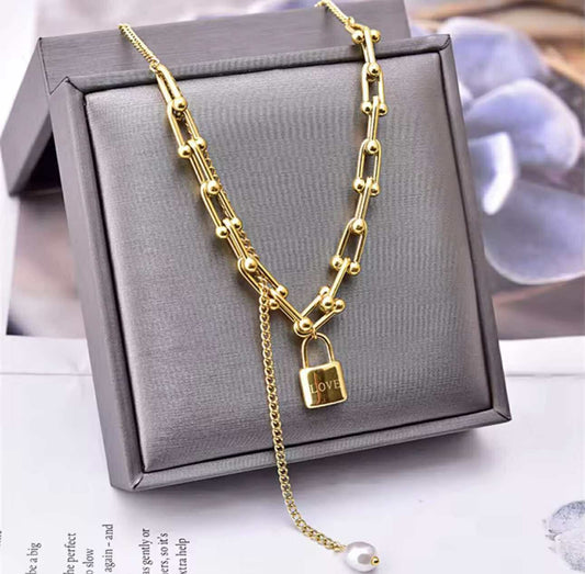 Discover the Love Lock Necklace – a bold, waterproof gold chain with vintage padlock and pearl detail. Designed in Australia by House of Hide for effortless, country-boho style.