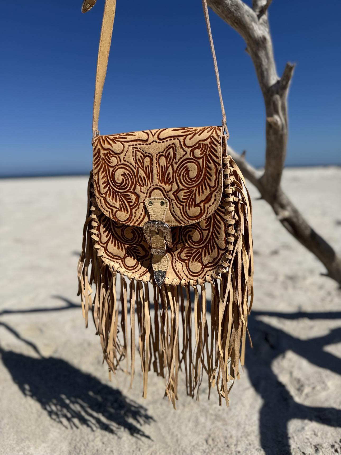 Double-sided fringe detailing swaying on the Savannah Western Fringe Bag for dynamic style.