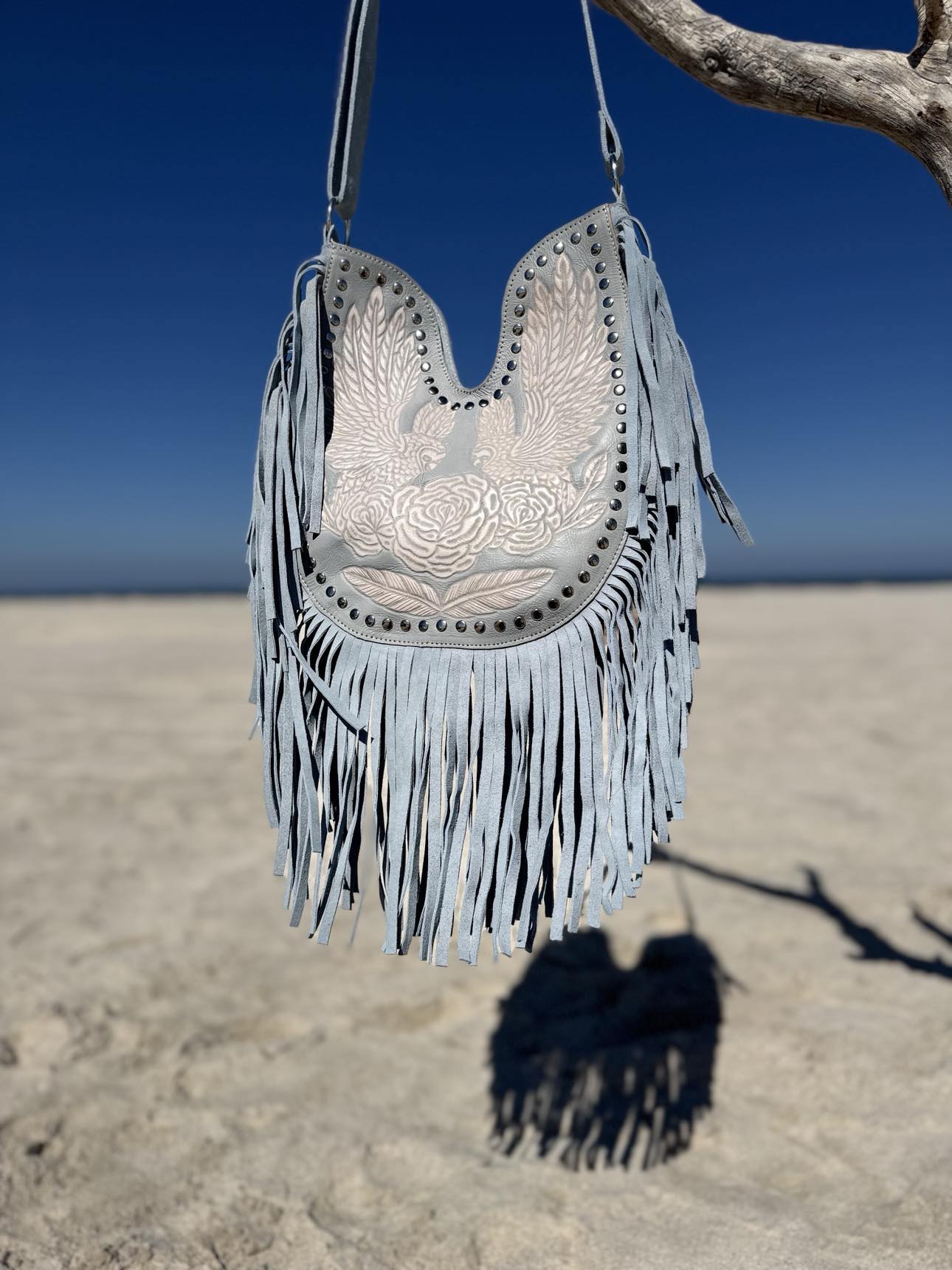 Fringe bag trend 2025: light blue boho handbag designed in Perth Hills, Australia.