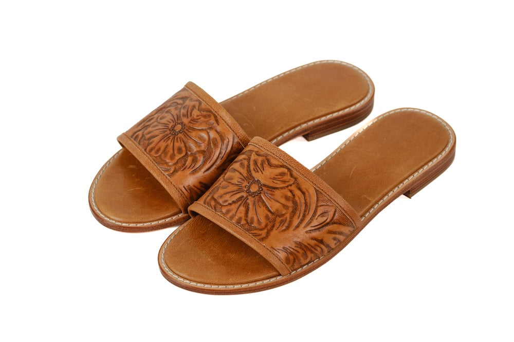 Front view of tan leather Madora Slides with hand-tooled floral detail