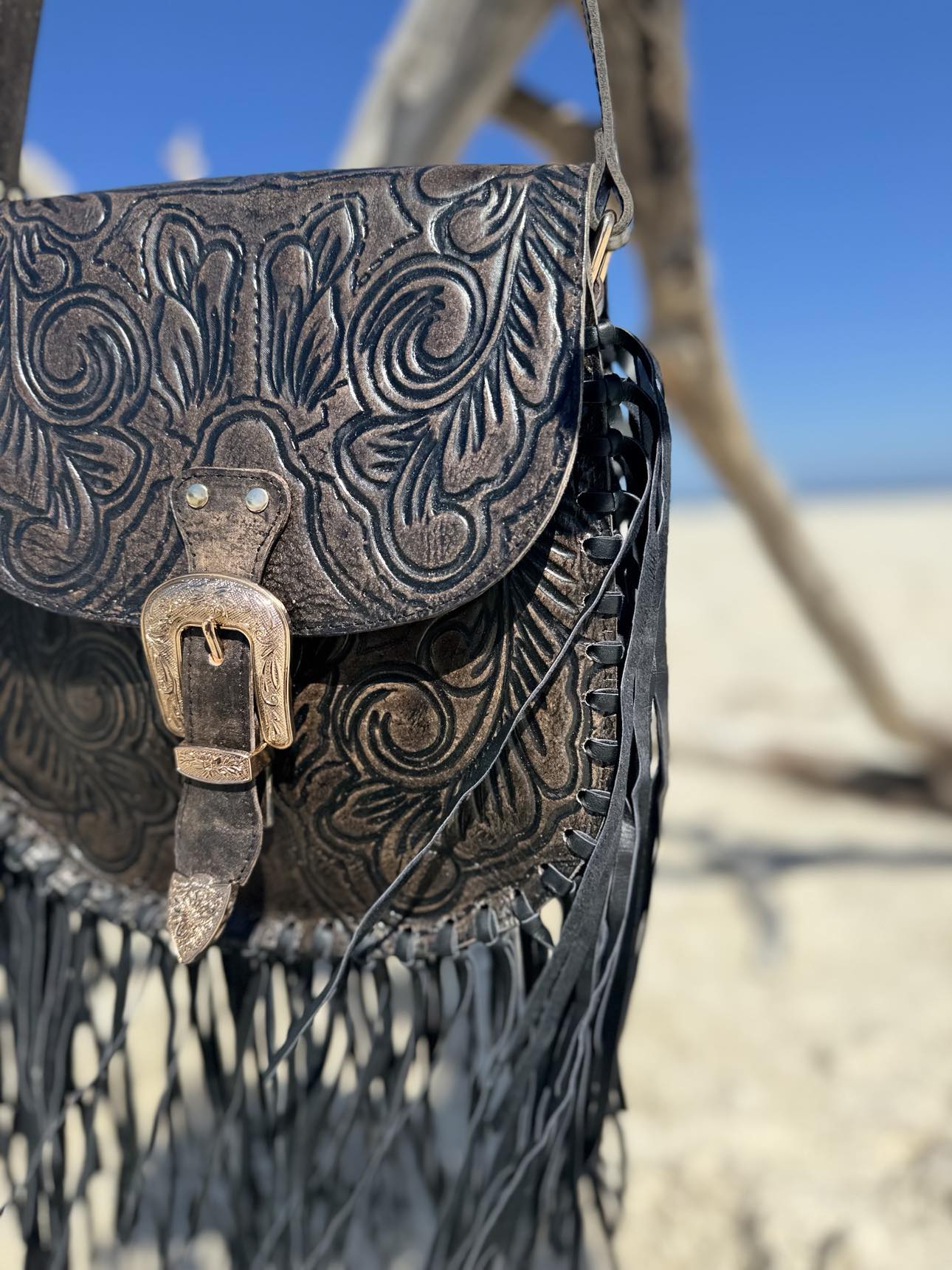 Full view of the Blackstone Crossbody on display, featuring premium black leather and adjustable strap for comfortable wear.