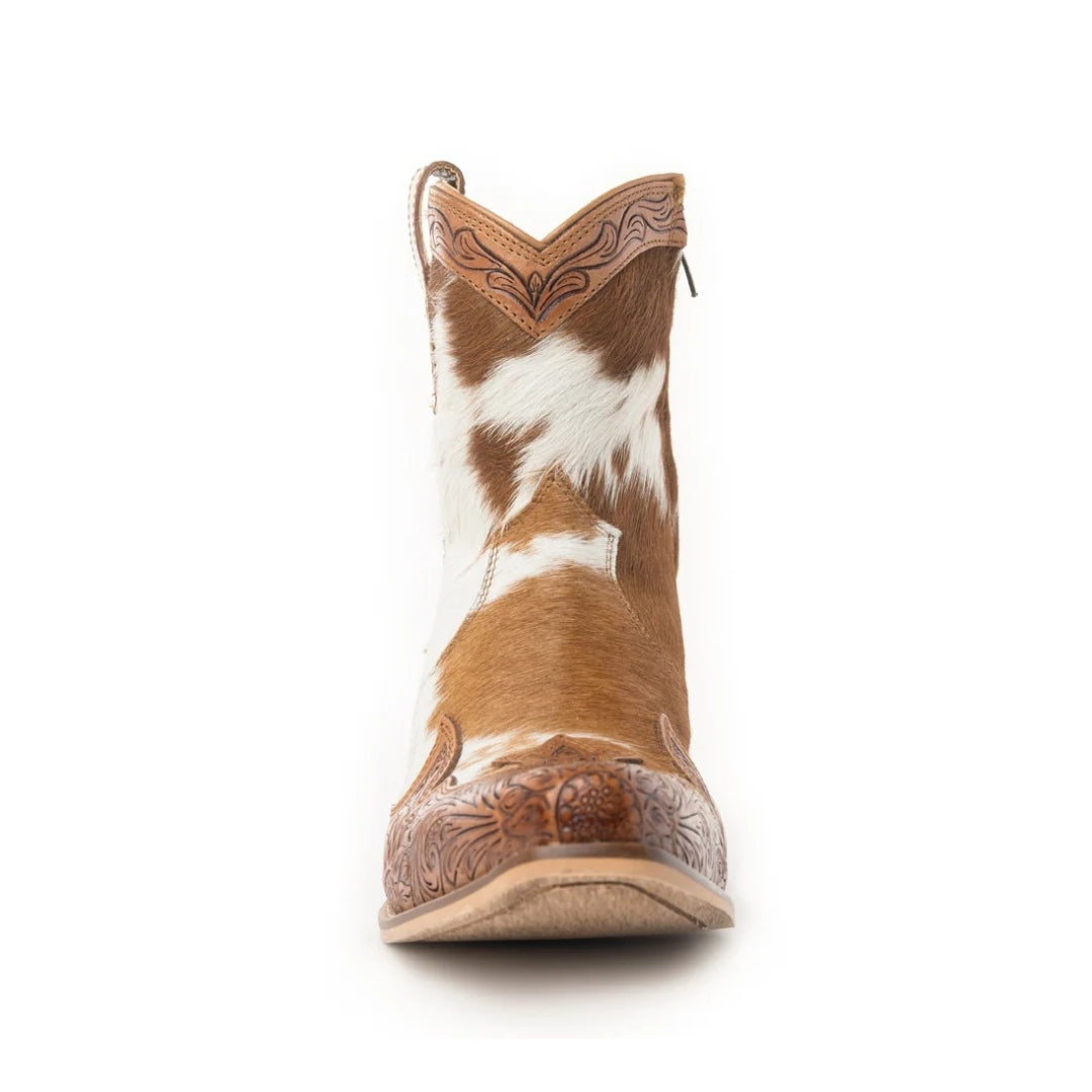 Front view of a Georgia ankle boot with tan and white cowhide, tooled leather trim and a snip toe.