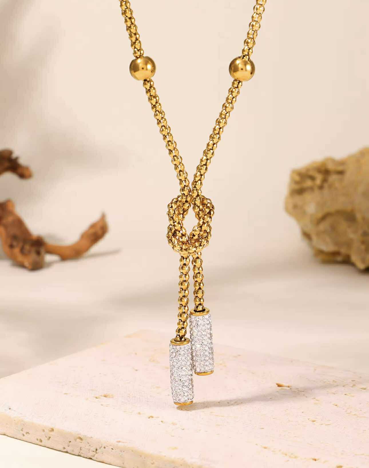 Gold-plated Y-necklace with rhinestone pendant, styled for country-boho fashion.