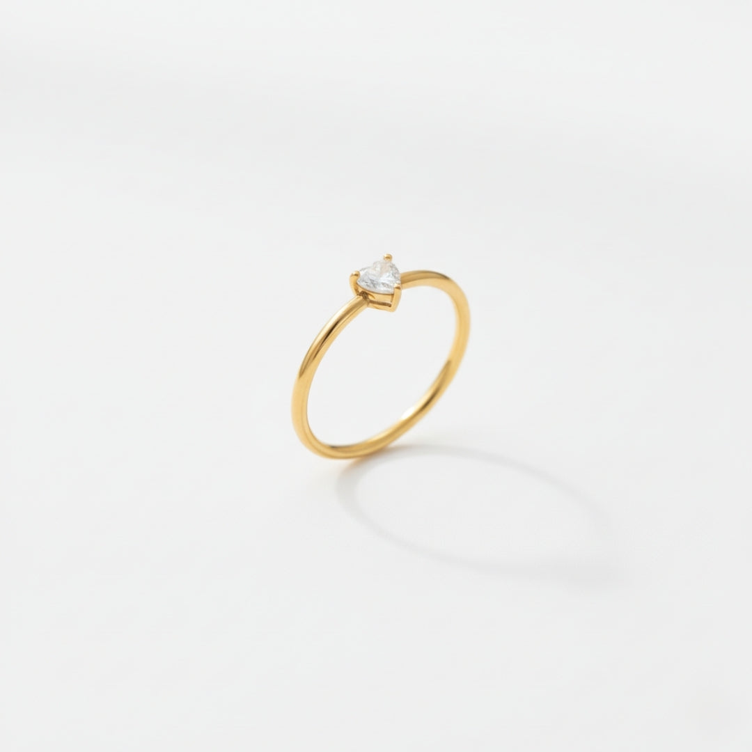 Golden Heartlight Ring Perth Australia Houseofhide on reflective surface.