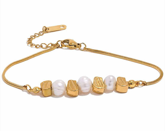 Golden Hour Bracelet featuring freshwater pearls and gold-plated stainless steel beads on neutral background.

