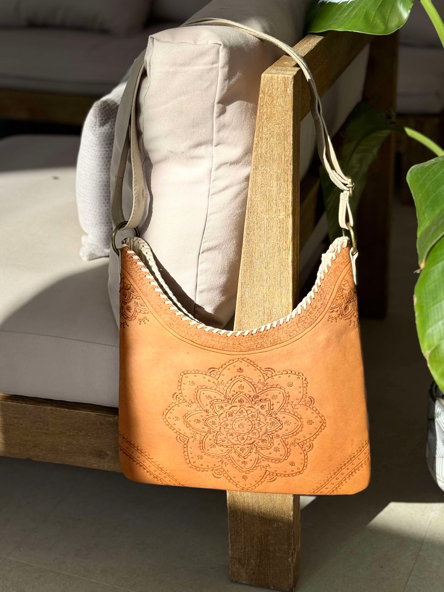 Hand-tooled Sienna Mandala Leather Tote Bag with intricate mandala design, boho style, and braided straps.