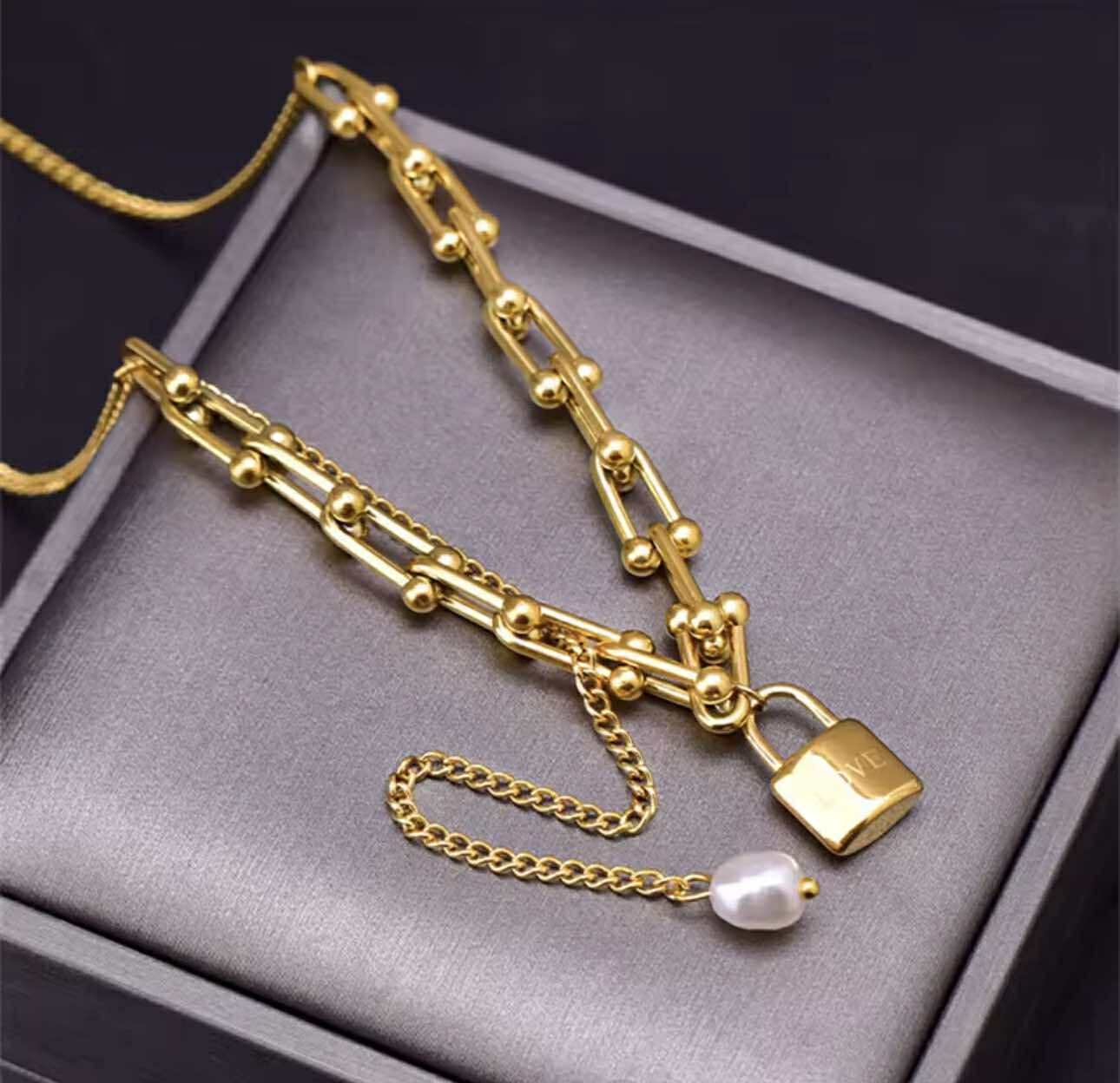 House of Hide gold padlock necklace with adjustable chain and romantic pearl accent