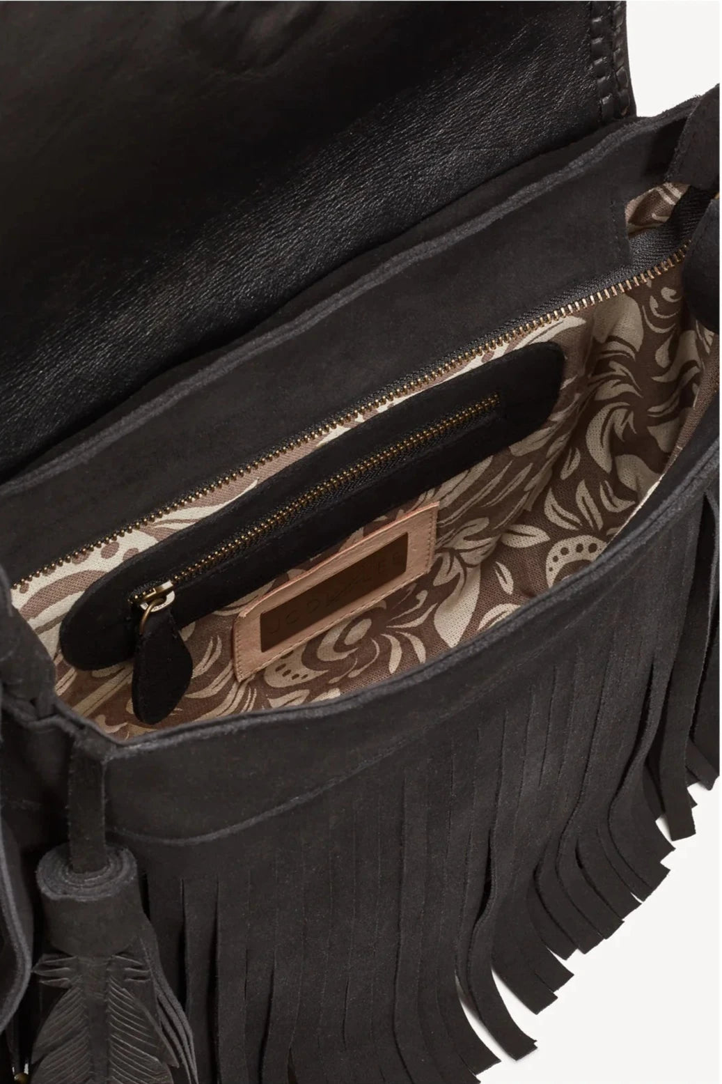 Interior view of the Raven Bag, showing hand-printed cotton lining and multiple pockets for organization.