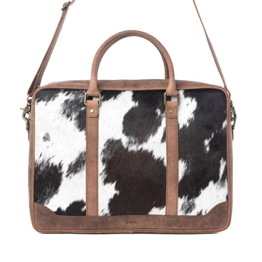 House of Hide genuine leather western handbag featuring a brown and white cow print with premium brown leather accents on a white background