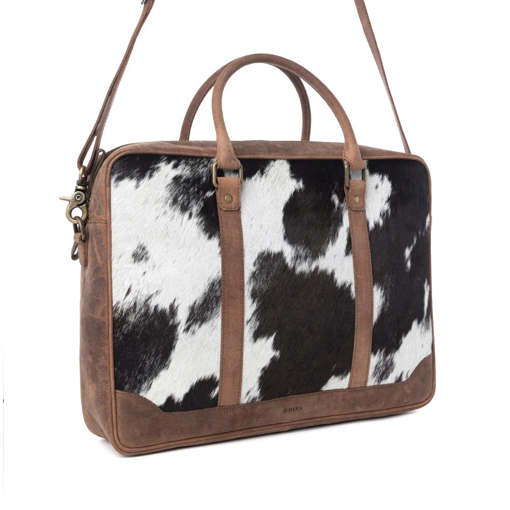 House of Hide premium genuine leather cow print handbag with rich brown leather accents on a white background