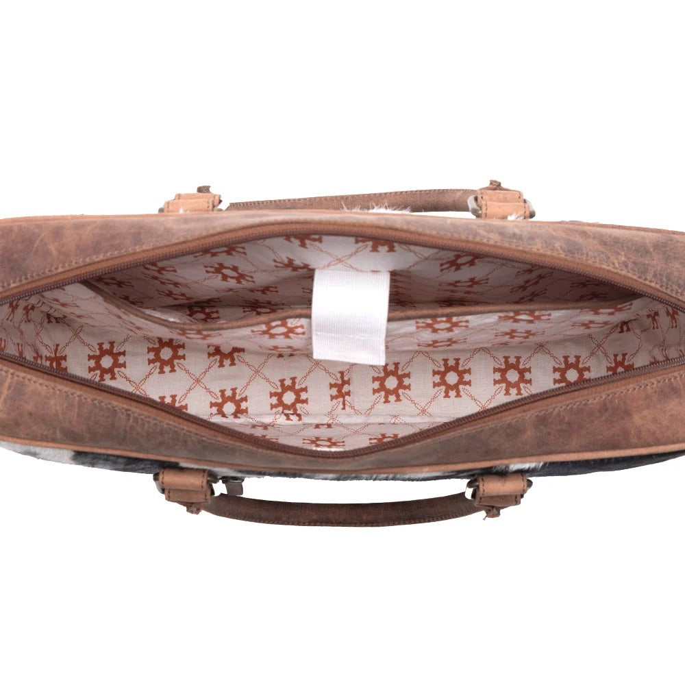 House of Hide genuine leather brown handbag with a patterned interior, showcasing premium craftsmanship on a white background