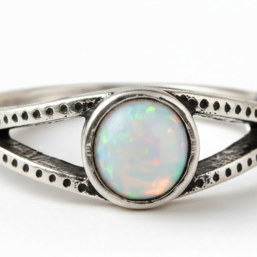 Elegant silver ring with central opal gemstone by House of Hide Perth jewellery