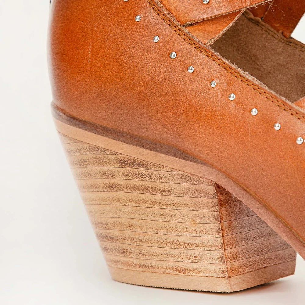Lace Up Booties In Calfskin from House of Hide in tan calfskin leather with wedge heel and wooden sole being displayed in close-up on white background