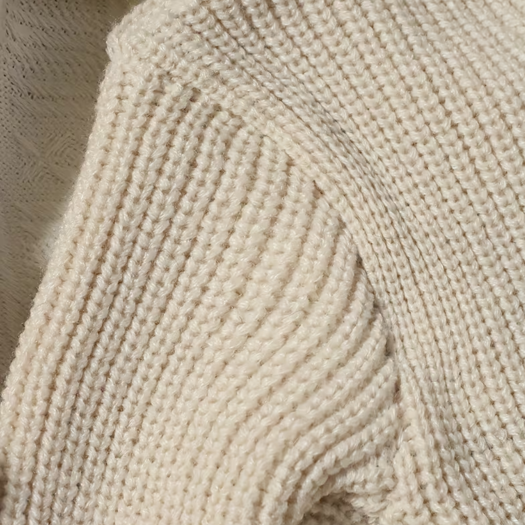 Little Wrangler Knit Romper Set from House of Hide in cream beige ribbed knit being displayed in close-up showing fabric texture and knit stitches
