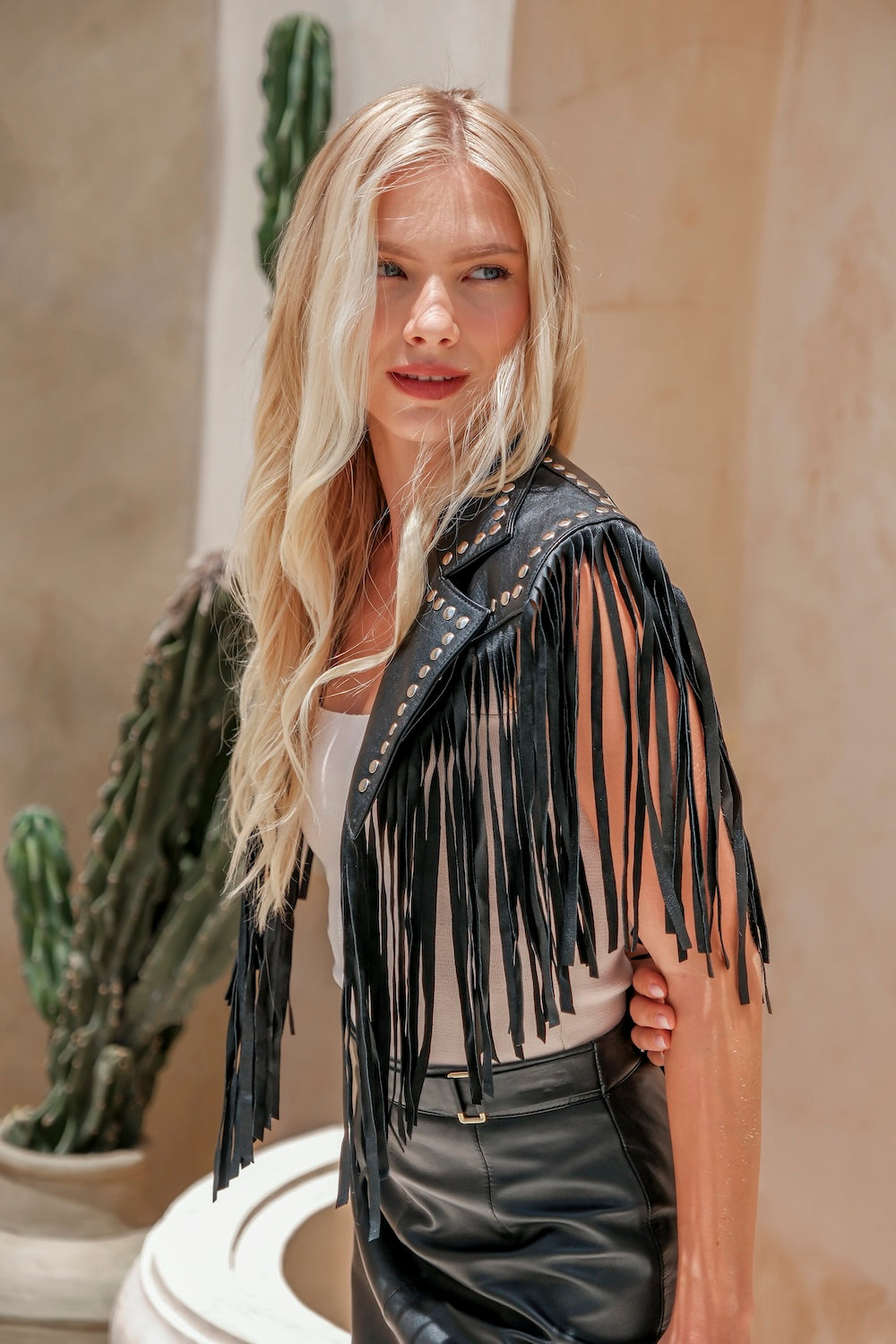 Lone Star Fringe Bolero – black cowhide leather with dramatic fringe, silver studs, and a striking white star on the back.