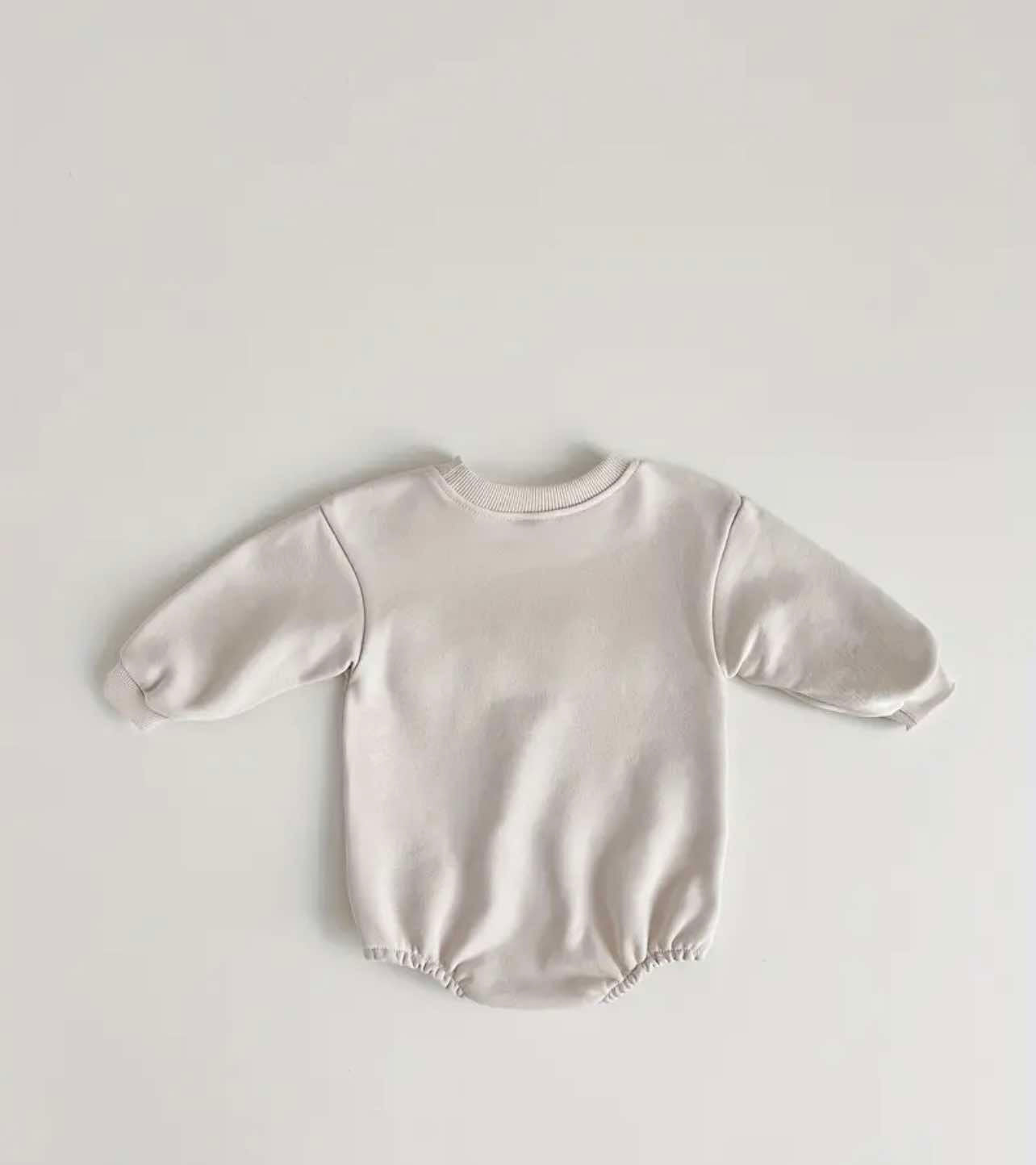 Long-sleeve beige romper with an O-neck collar, ideal for spring and autumn outings in Australia.