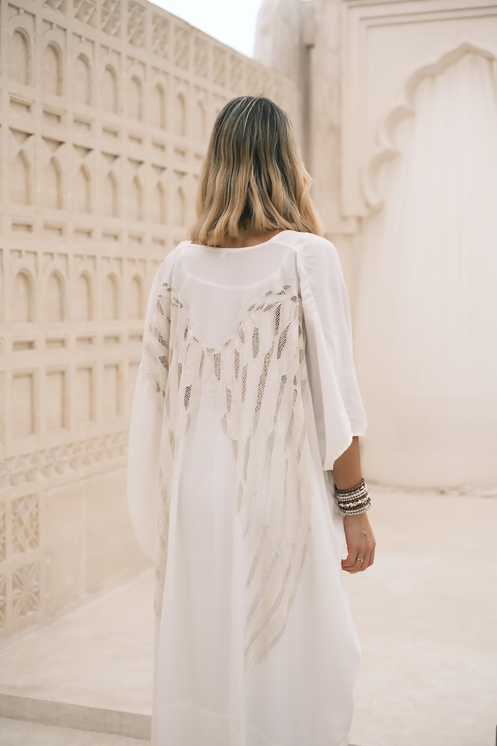 Longline bohemian kimono in apricot and white, styled with wide sleeves and relaxed fit