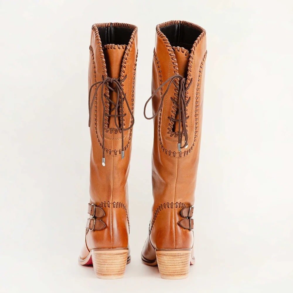 House of Hide genuine leather brown knee-high cowboy boots featuring decorative stitching and classic western-inspired craftsmanship on a white background