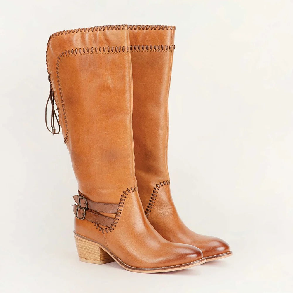 House of Hide genuine leather brown knee-high cowboy boots showcasing classic western style and premium craftsmanship on a light beige backg