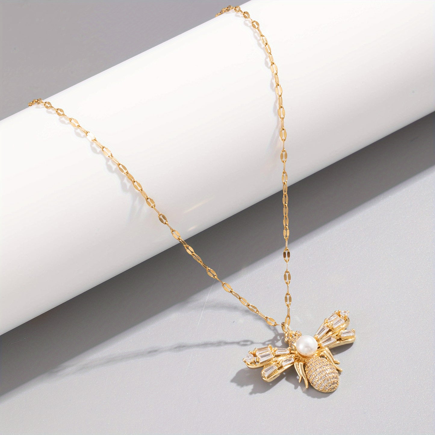 Dazzling Luna Bee Necklace with pearl and crystal bee charm, blending luxury and whimsical sophistication.