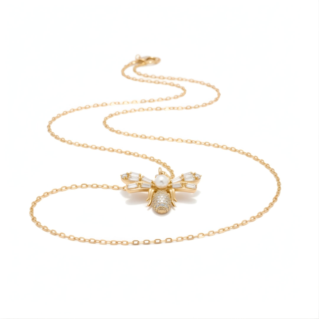 Elegant Luna Bee Necklace from House of Hide, showcasing shimmering crystal details and lustrous pearl design.
