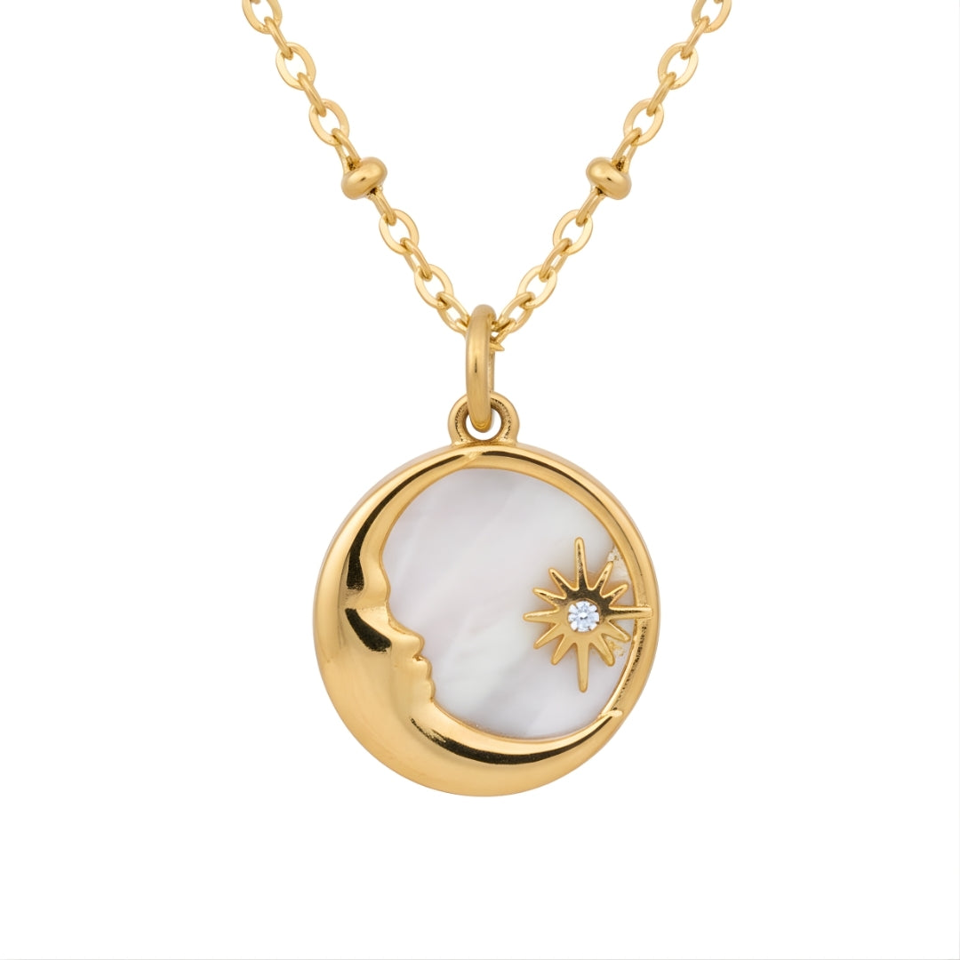 Luxury gold moon pendant necklace photographed on soft light background House of Hide
