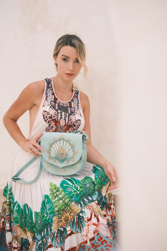 Mia Shell Bag in turquoise leather with shell mandala tooling. Artisan crossbody, small‑batch made in Western Australia, shipped globally.